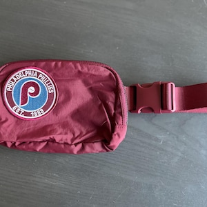 Phillies Burgundy Belt Bag with embroidered patch. Bag is approximately 8”x5”x2”