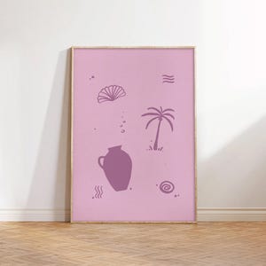 May include: A framed pink art print featuring a purple vase, palm tree, seashell, and other abstract shapes. The artwork has a minimalist style and is displayed on a light pink background. The frame is a light brown color.