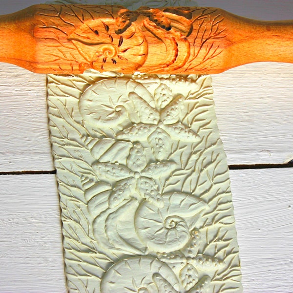 rolling pin with a pattern for dough and clay with a marine pattern