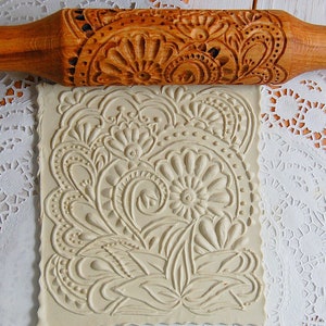 Rolling pin carved with Hindi pattern