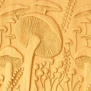 Rolling pin carved, A rolling pin for clay, a rolling pin with a carved pattern of mushrooms.