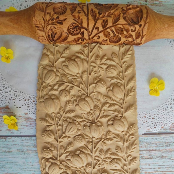 Rolling pin carved with a pattern of tulip flowers