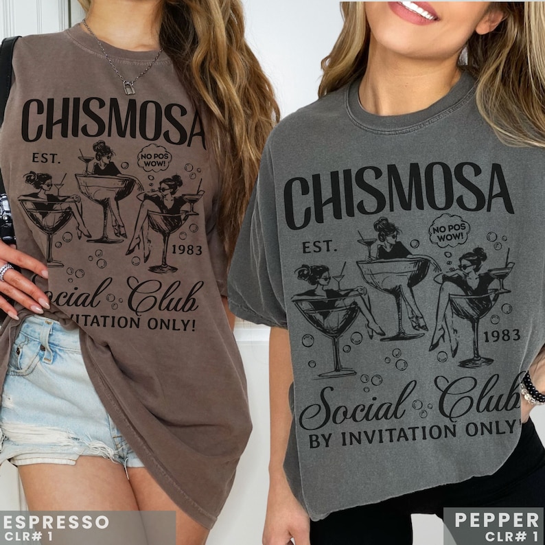 Two models in Comfort Colors brand shirt with graphic of Chismosa Social Club in color black. Ovesized shirts in colors espresso & pepper.