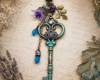The Secret Garden Key Necklace – Turquoise Skeleton Key Pendant with Purple Flowers & Crystal Charms
