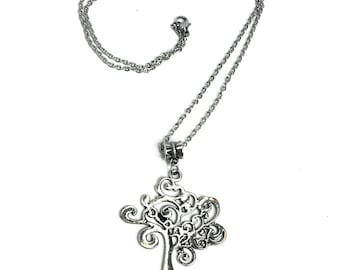 May include: A silver chain necklace with a tree of life pendant. The pendant is made of intricate metalwork and has a delicate, swirling design.