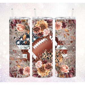 May include: Three stainless steel tumblers featuring a fall floral design and a football graphic. The tumblers have a distressed wood background with a faded American flag design.
