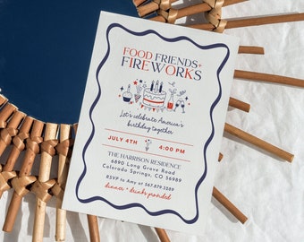 May include: A white invitation card with blue and red accents. The card features the text "Food Friends + Fireworks" and a cartoon illustration of a cake, fireworks, and a bottle of wine. The text "Let's celebrate America's birthday together" is also included. The card also includes the date "July 4th" and the time "4:00 PM". The text "The Harrison Residence" is included along with the address "6890 Long Grove Road, Colorado Springs, CO 56989". The text "RSVP to Amy at 567.879.3289" is included. The text "dinner + drinks provided" is also included.