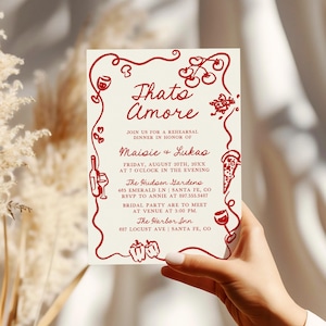 May include: Red and white invitation card with a red border and illustrations of food and wine. The text reads "Thato Amore" and includes the names "Maisie & Lukas" and the details for a rehearsal dinner.