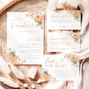 May include: Baby shower invitation set with a pumpkin theme. The invitation features the text "A Little Pumpkin is on the Way!" and includes details for the event. Coordinating cards for diaper raffle and books for baby are also included.