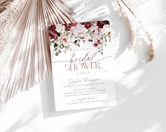 May include: A rectangular bridal shower invitation card featuring a floral header of burgundy and blush roses with green eucalyptus leaves. The text reads: Join is for a bridal SHOWER in honor of Saysha Thompson, Saturday, August 10th, 20XX at 12 PM.