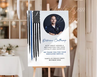 May include: A rectangular 18x24 inch foam board sign featuring a thin blue line flag graphic, a circular portrait of a police officer, and text reading Officer Calloway, With Great Honor & Recognition For Your Loyalty And Sacrifice, We Thank You For Your Dedicated Service, Santa Fe Police Dept. Retired 2026.