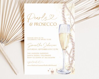 May include: A rectangular bridal shower invitation card featuring the text Pearls & PROSECCO, a watercolor illustration of a champagne flute, and strings of white pearls. The card includes event details for Samantha Johnson on Saturday, September 6th at 12 PM at The Hudson Gardens in Santa Diego, Colorado.