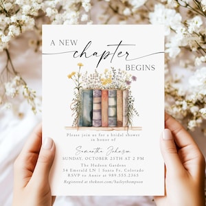 May include: A bridal shower invitation with a watercolor illustration of a stack of books with flowers on top. The text reads "A new chapter begins" and includes the bride's name, date, time, location, and RSVP information.