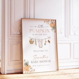 May include: A rectangular 18x24 inch poster paper featuring the text A little PUMPKIN IS ON THE WAY! WELCOME TO Samantha's BABY SHOWER We're so glad you're here! with illustrations of pumpkins, a basket, baby clothes, and shoes.