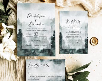 May include: A wedding invitation suite featuring a watercolour forest landscape in shades of blue and green. The set includes a main invitation for Madilynn and Brandon, a details card, and a reply card, all with black script and serif text.
