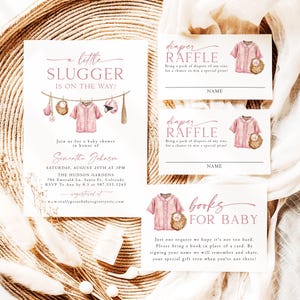 May include: Baby shower invitation set with a baseball theme. The invitation features the text "a little slugger is on the way!" and includes diaper raffle and book request cards. The design includes pink baseball jerseys and baseball equipment.