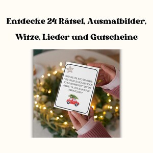 May include: A white card with a red car and a Christmas tree on top. The card has text that reads "FRAGT DAS EINE AUTO DAS ANDERE: "UNG, FREUST DU DICH AUCH SCHON SO AUF WEIHNACHTEN?" SAGT DAS ANDERE: "JA, VOR ALLEM AUF DIE PARKPLATZCHEN."