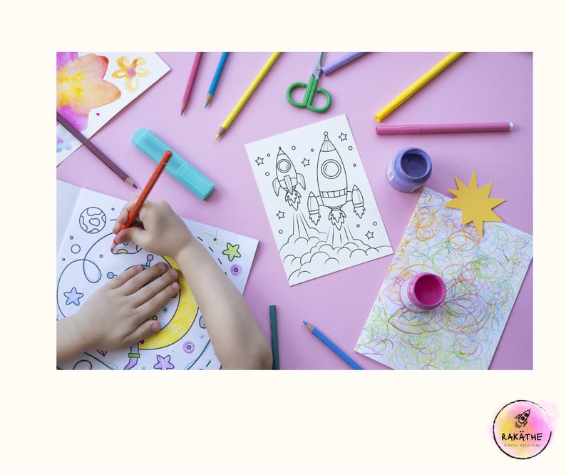 May include: A child's hand coloring a rocket ship on a white sheet of paper. The paper is on a pink surface with other coloring supplies, including colored pencils, markers, and paint.