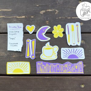 Originals-stickerspakket 'Happy'. Set calcomania's. violet, geel, wit. sering, amarillo, blanco. 9 originele stickers. 9 originelen.