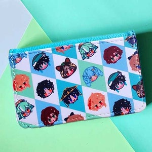 May include: A white wallet with a blue trim and a pattern of cartoon character faces on a checkered background of white and light blue. The wallet is rectangular and appears to be made of a synthetic material.