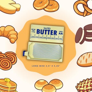 May include: A cartoon image of a butter dish with the words "Salted Butter" and measurement markings. The butter dish is 6.35 cm by 13.34 cm. Various baked goods, including donuts, croissants, and bread, surround the butter dish.