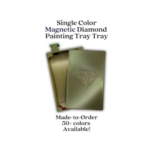 May include: A gold-colored magnetic diamond painting tray with a rectangular lid featuring an embossed diamond shape. The tray has internal grooved channels for organizing beads. Text on the image reads: Single Color Magnetic Diamond Painting Tray.