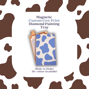 May include: A custom diamond painting tray with a cow print design. The tray is blue and white with a cow pattern. The image also includes text that says "Magnetic Custom Cow Print Diamond Painting Tray" and "Made-to-Order 50+ colors Available!"