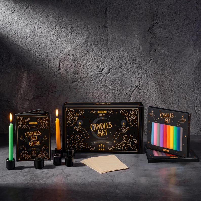 May include: A candle set with a black box featuring gold accents and the words "Candles Set". The set includes a guide, candles in various colors, and black candle holders. The candles are lit, casting a warm glow.