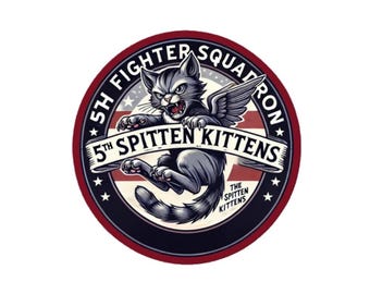 May include: A red, white, and blue circular patch with a black border and white stars. The patch features a cartoon gray cat with wings, flying and holding a banner that reads "5th SPITTEN KITTENS". The text "5TH FIGHTER SQUADRON" is written around the outside of the circle. The text "THE SPITTEN KITTENS" is written in a smaller font below the banner.