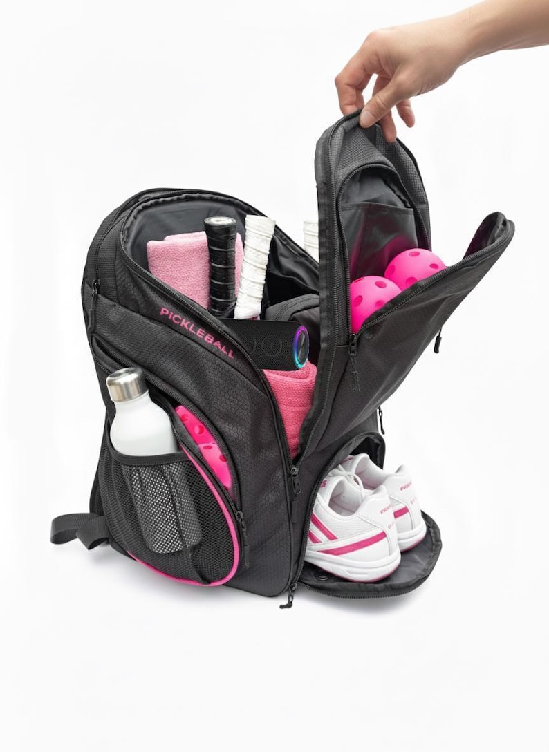Pink pickleball backpack with ball storage, water bottle mesh pocket, shoe container, and plenty more room. Large and spacious bag.
