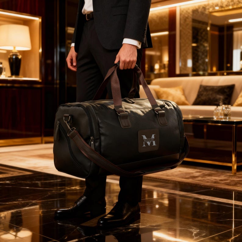 Groomsmen gift of a leather duffel bag monogrammed with their name.