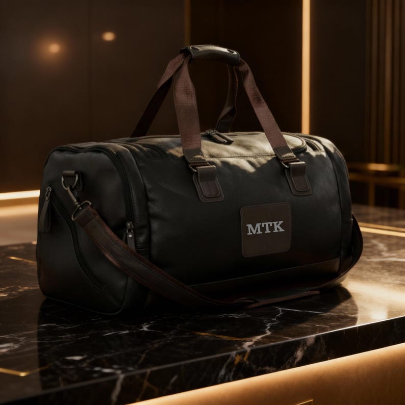 Personalized leather travel bag engraved with a custom monogram.