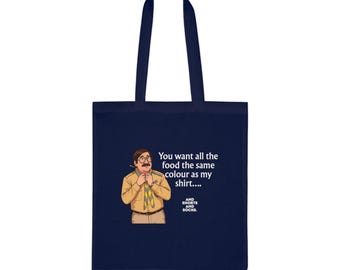 May include: A navy blue tote bag featuring a graphic of a person wearing a tan shirt, glasses, and a yellow and blue neckerchief. The text reads: You want all the food the same colour as my shirt.... AND SHORTS AND SOCKS.