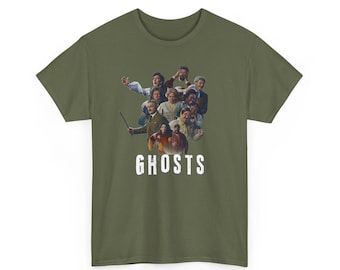 May include: An olive green short-sleeve t-shirt featuring a central graphic print of a diverse group of people in various historical costumes. Below the group, the word GHOSTS is printed in a bold, white, distressed, sans-serif font.