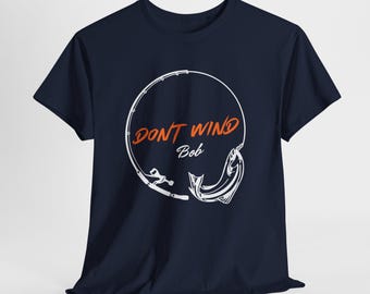 May include: Navy blue t-shirt with a white graphic of a fishing rod and a fish in a circle. The text "DON'T WIND Bob" is written in orange inside the circle.