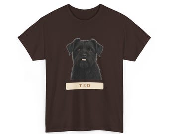 May include: A dark brown short-sleeved t-shirt featuring a centered graphic of a black dog with a shaggy coat and visible teeth. Below the dog illustration is a light beige rectangular label with the name TED printed in dark brown letters.