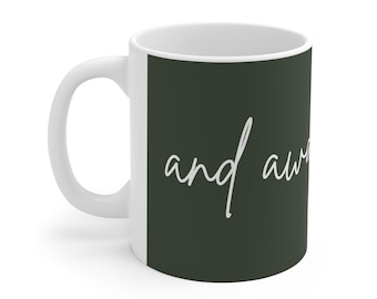 May include: White ceramic mug with a dark green background and the text "and aware" in white script.