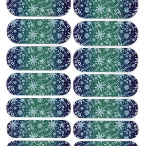 May include: A sheet of nail wraps with a floral design. The wraps feature a gradient of blue and green with white floral patterns. The brand name "jamberry" is printed at the bottom, along with the text "16A8 - Tropical Forest 0916".