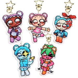 May include: Five acrylic keychains featuring cartoon characters with distinct color palettes, including pink, blue, red, and green. Each charm has a gold-toned star-shaped clasp. The characters display various expressions and outfits.