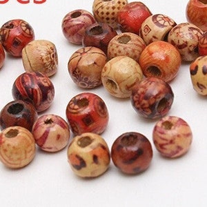 May include: A collection of 100 wooden beads with red and brown patterns. The beads are round and have a hole in the center. 100pcs.