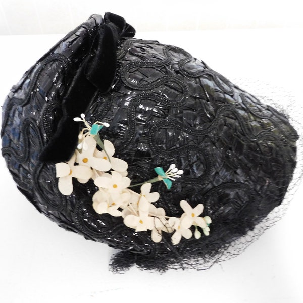 Vintage 1950s Ladies Black Bonnet Style Hat Woven Plastic Fabric Flower Accents Black Velvet Ribbon at Back Casual Costume Wear