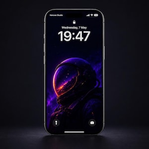 May include: A silver smartphone displays a space-themed wallpaper featuring an astronaut helmet with a vibrant nebula background. The screen shows the time as 19:47 on Wednesday, May 7th. The phone is set against a dark background.