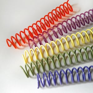 May include: Five plastic spiral binding coils arranged diagonally. The coils are colored in bright red, deep purple, pale yellow, muted olive green, and periwinkle blue. Each coil features a continuous helical design for document binding.