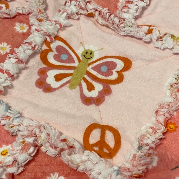 Handmade Baby/Toddler Rag Quilt in Soft Peach colors Butterflies and Flowers. Measures 32” X 32”. Very sweet! Soft and Cozy! Super Cute!