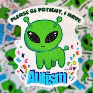 May include: A white sticker with a green alien cartoon character. The alien has large eyes and a big head. The sticker says "Please be patient. I have autism." and has colorful confetti around the alien.