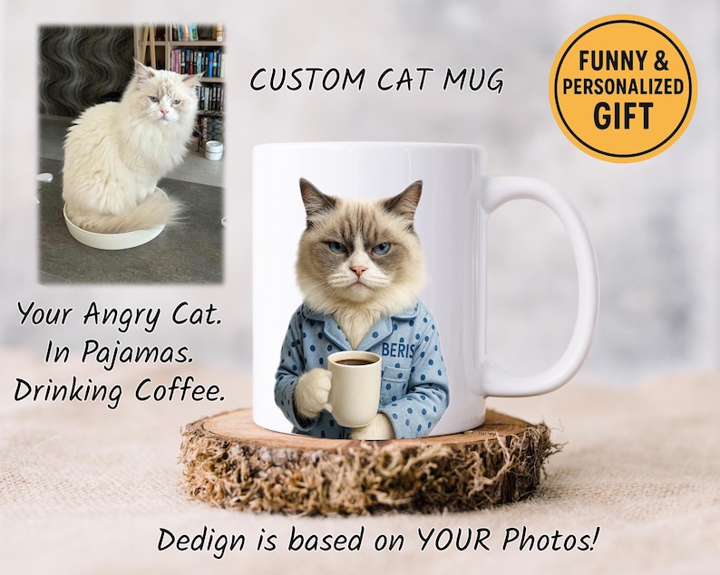 May include: A white ceramic mug featuring a cat wearing blue pajamas and holding a coffee cup. The mug is on a wooden coaster. Text on the mug says "CUSTOM CAT MUG" and "FUNNY & PERSONALIZED GIFT". Additional text reads "Your Angry Cat. In Pajamas. Drinking Coffee."