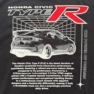 May include: Black t-shirt featuring a graphic of a Honda Civic Type R car with the text "HONDA CIVIC TYPE R" in white. The text "THE POWER OF DREAMS" is printed vertically on the right side.