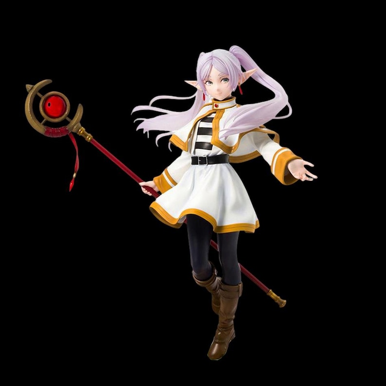 May include: A figurine of a character with long, light purple hair and pointed ears, wearing a white and gold outfit with a black belt. The figure holds a red staff with a gold and red orb at the top. The background is black.