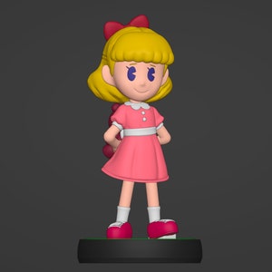 May include: A figurine of a young girl with blonde hair, wearing a pink dress with a white collar and a red bow. She is standing on a black base.