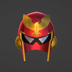 May include: A red and gold helmet with a stylized eagle design on the top. The helmet has a black visor with a silver trim.